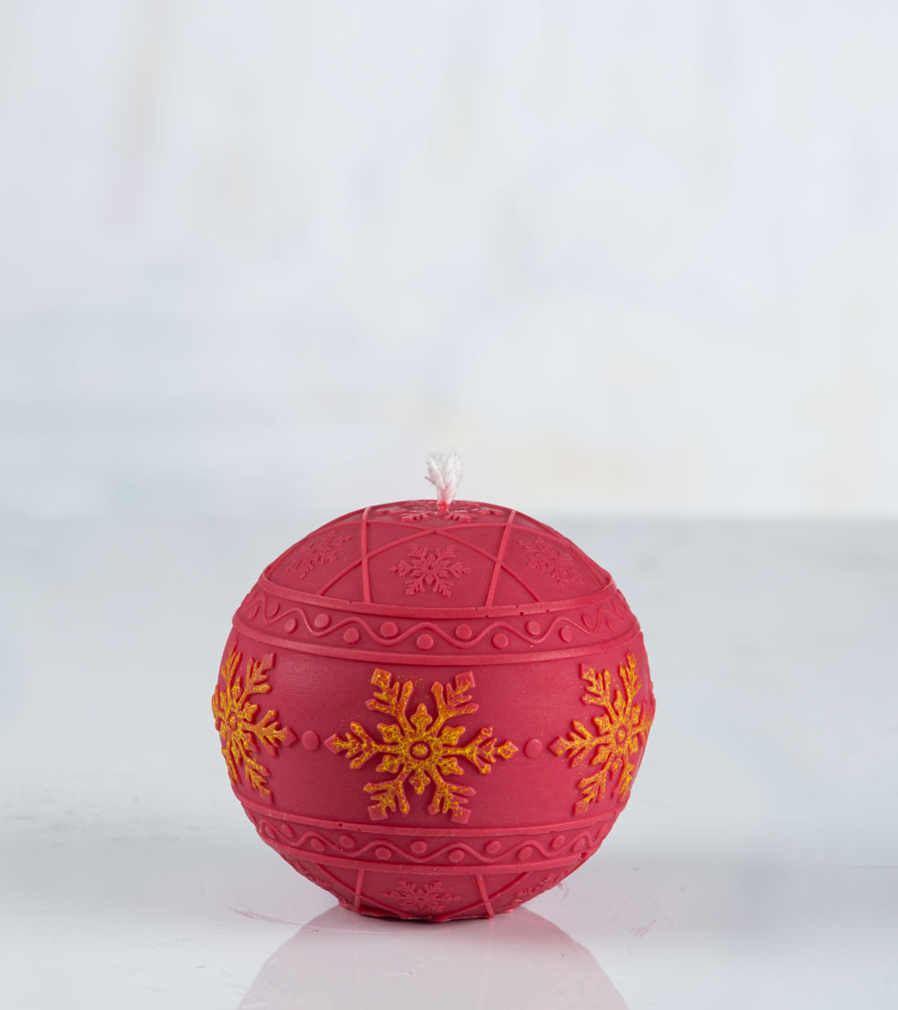 Bougie ronde "Flocon de neige" rouge et jaune – avec flocons de neige peints à la main sur une bande.
